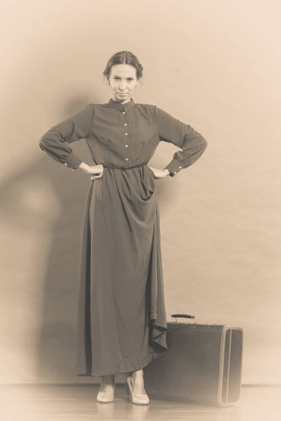 istock Woman retro style with old suitcase 657024988