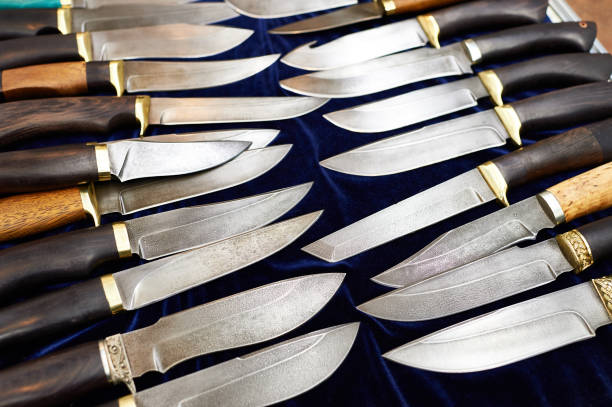 istock Forged hunting knives on dark 657028146