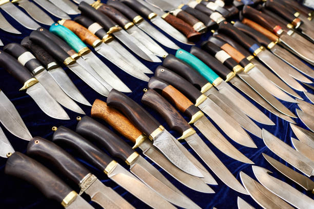 istock Forged hunting knives on dark 657028502