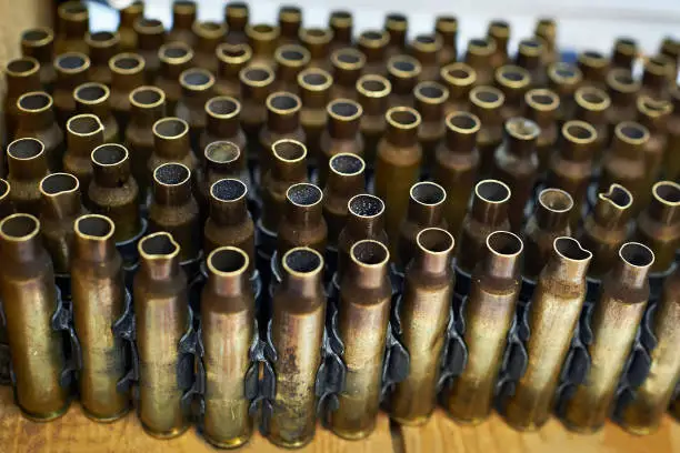 Brass cases of cartridges in a machine-gun tape
