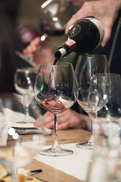 istock sommelier pouring wine into glass at wine tasting 657031752