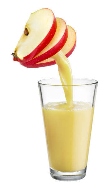 istock Fresh juice pours from apple fruit into the glass isolated on white background. 657042202