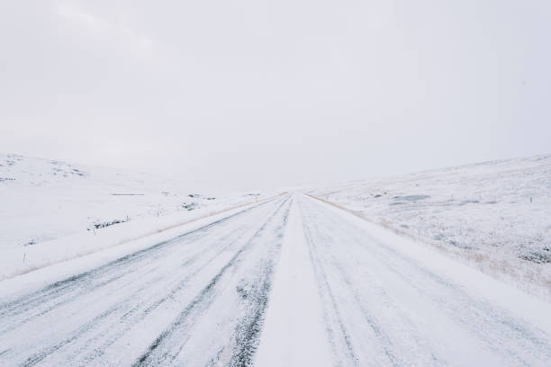istock Snowy empty driving road in the winter Iceland 657042568