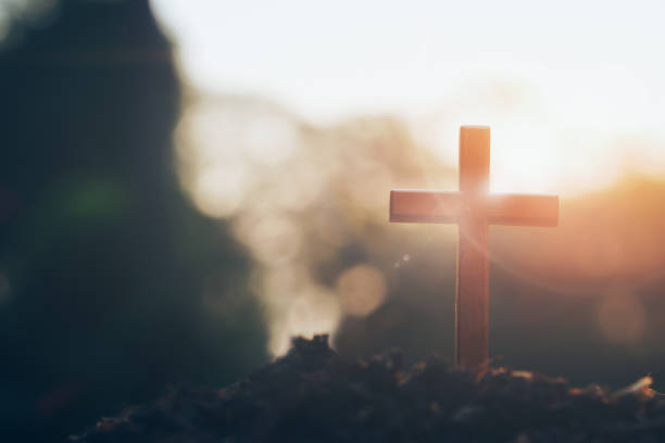 Christian, Christianity, Religion background. cross on blurry sunset background. Christian, Christianity, Religion copyspace background. atlantic islands photos stock pictures, royalty-free photos & images