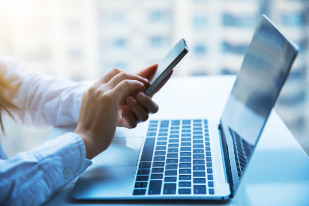 istock Businesswomen using smartphone in office 657049516