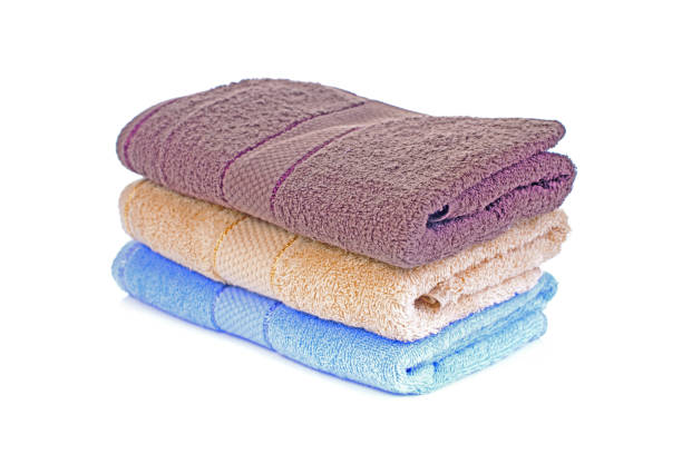 istock Stack of colorful towels isolated on white 657052154