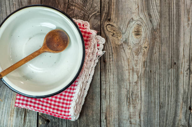 istock Empty iron bowl with a wooden spoon 657055994