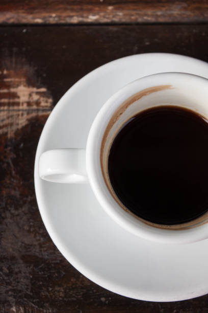 istock Cup of black coffee on wooden background 657056290