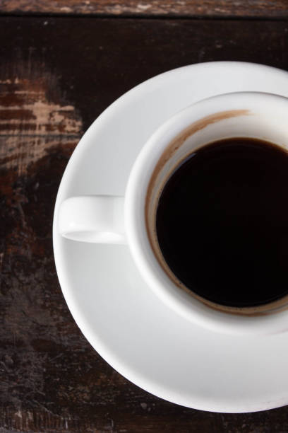 istock Cup of black coffee on wooden background 657056330