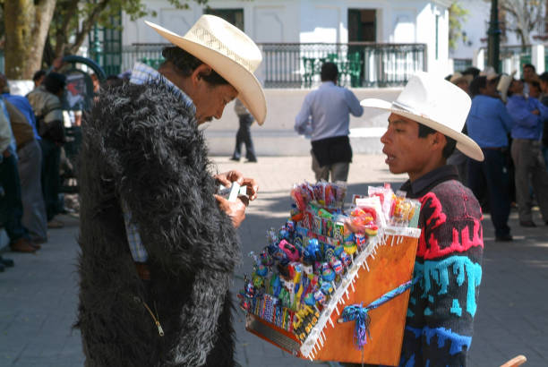 maya boy selling cigarettes at the market of San Cristobal de las Casas on Chiapas, Mexico