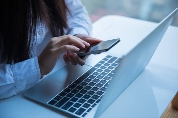 istock Businesswomen using smartphone in office 657070198