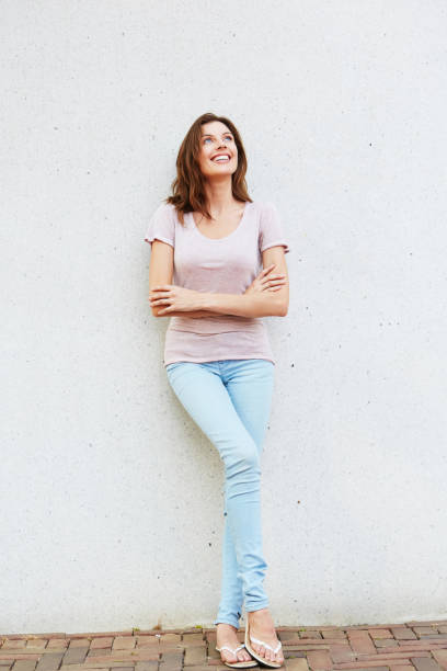 istock attractive young woman looking away and smiling 657079770