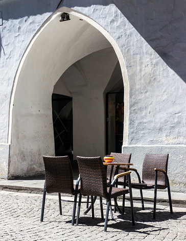 table and chairs at a sidewalk cafe