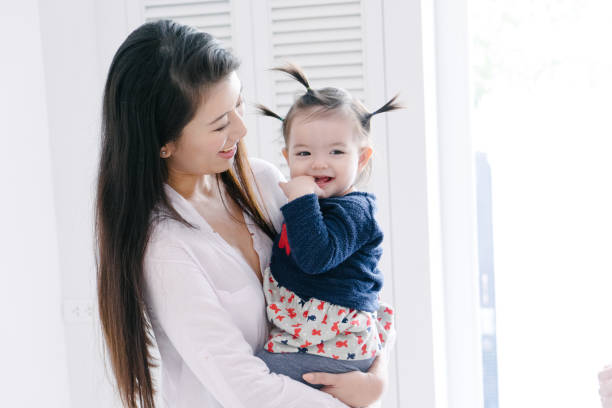 istock Young mother carrying daughter and playing 657083526