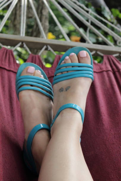 istock Woman`s legs in the hammock. 657083560