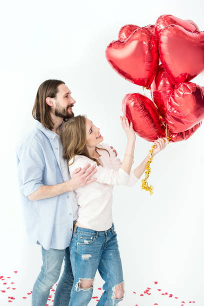 istock Couple with air balloons 657087786