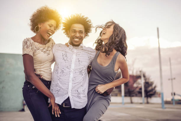 istock group of three young cuban people celebrating outdoors in Havanna 657088062