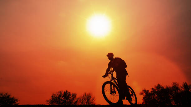 istock Man Riding a Bicycle on Nature Background 657090468