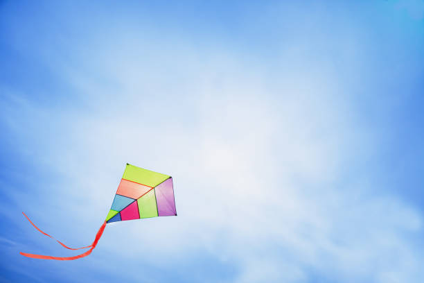 istock colorful kite flying with waving red bow 657097310