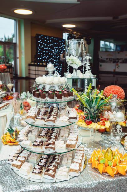 istock Chocolate choux pastries on glass stand on the wedding candybar 657097486