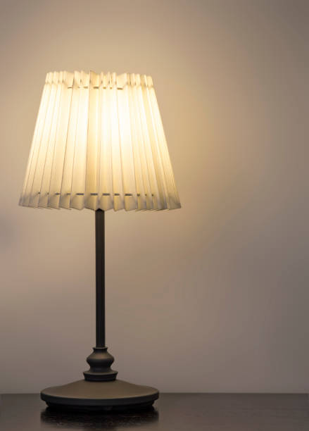 istock Desk lamp on the wood table 657099776