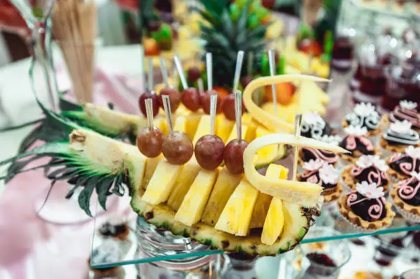 pineapple on the candybar table. a lot of differen sweets