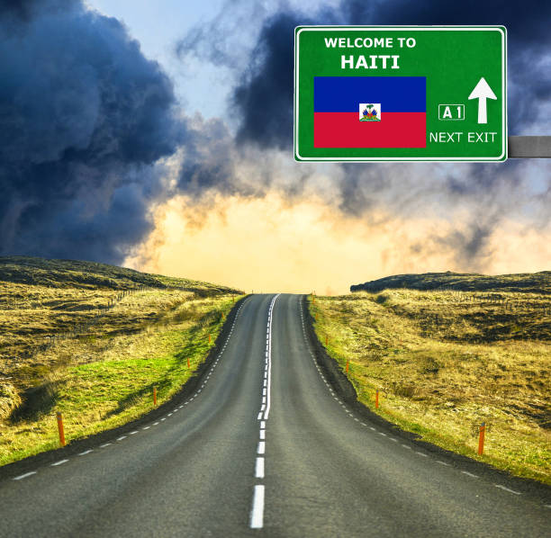 istock Haiti road sign against clear blue sky 657106174