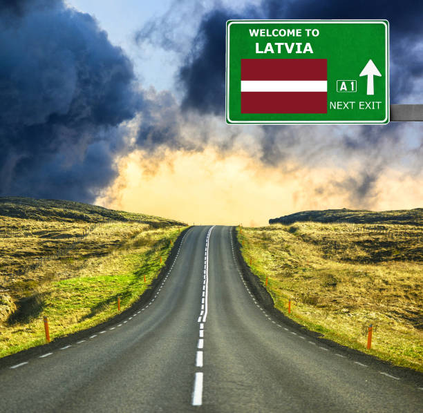 istock Latvia road sign against clear blue sky 657106272
