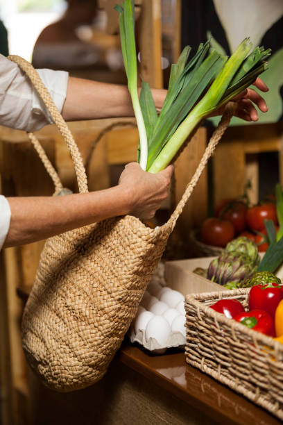 istock Woman buying leafy vegetable at organic section 657107040