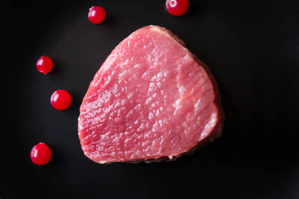 istock Fresh game meat on black plate and wooden table 657107580