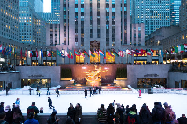 People enjoying Rockefeller Center Ice Skating People enjoying Rockefeller Center Ice Skating rockefeller ice rink stock pictures, royalty-free photos & images