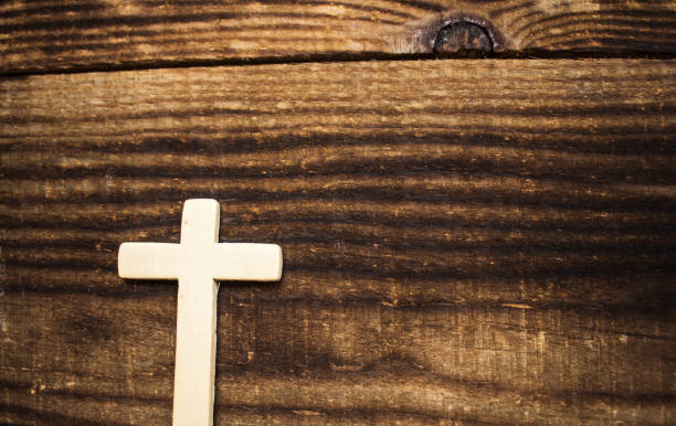 istock wooden cross on dark wooden background 657122084