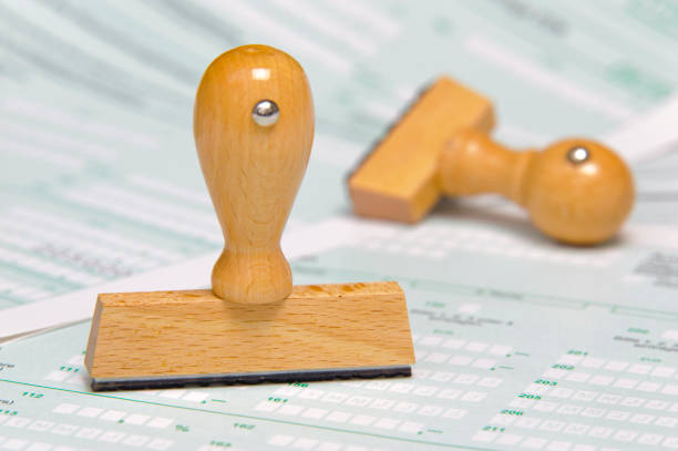 istock tax form and  blank rubber stamp is ready for your text 657122584