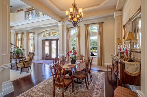Entryway to a beautiful estate home showing dining area.