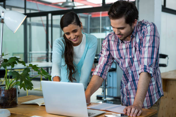 istock Business executives discussing over laptop 657125340