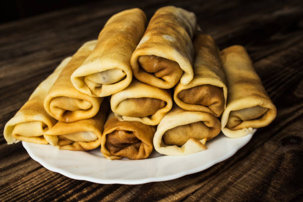 istock stuffed crepe stacked on white plate 657125472