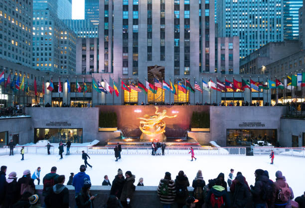 People enjoying Rockefeller Center Ice Skating People enjoying Rockefeller Center Ice Skating rockefeller ice rink stock pictures, royalty-free photos & images