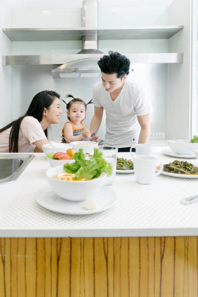 istock Young family having breakfast in the kitchen 657129128
