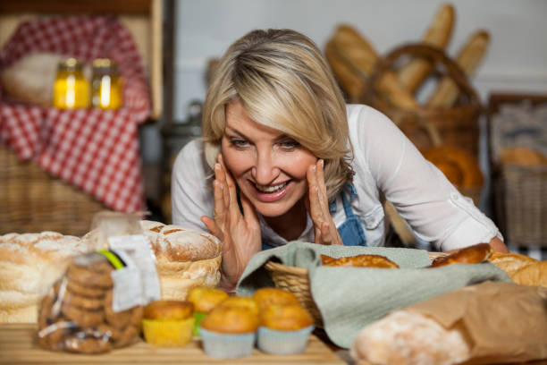 istock Female staff looking at various sweet food 657129140