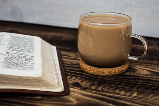 istock bible and coffee with milk on wooden background 657130638