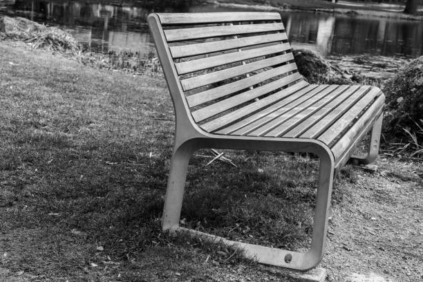 istock Close-up of a park bench in a public park 657143060