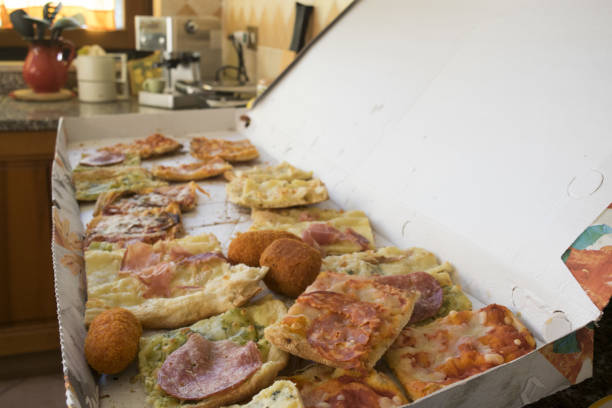 carton of assorted take away pizza with croquettes