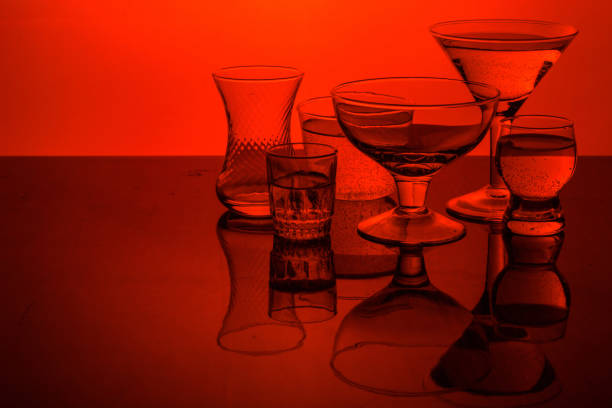 Glass shined with colored light on a light background. A high key.