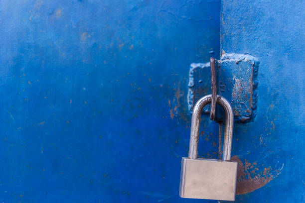 istock The padlock on the metal blue door. Concept: safely, storage, security 657147108