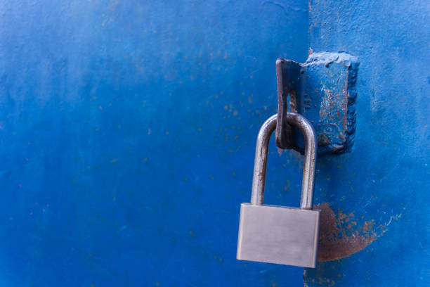 istock The padlock on the metal blue door. Concept: safely, storage, security 657147132