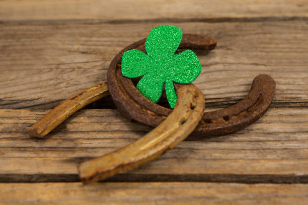 istock St Patricks Day shamrock with two horseshoes 657148192