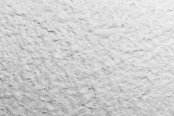 istock White decorative plaster on the wall. Art background. 657170710
