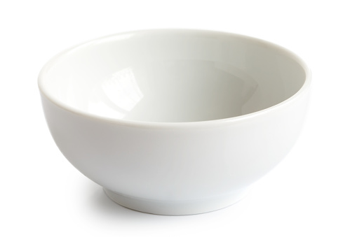 White empty ceramic bowl isolated on white.