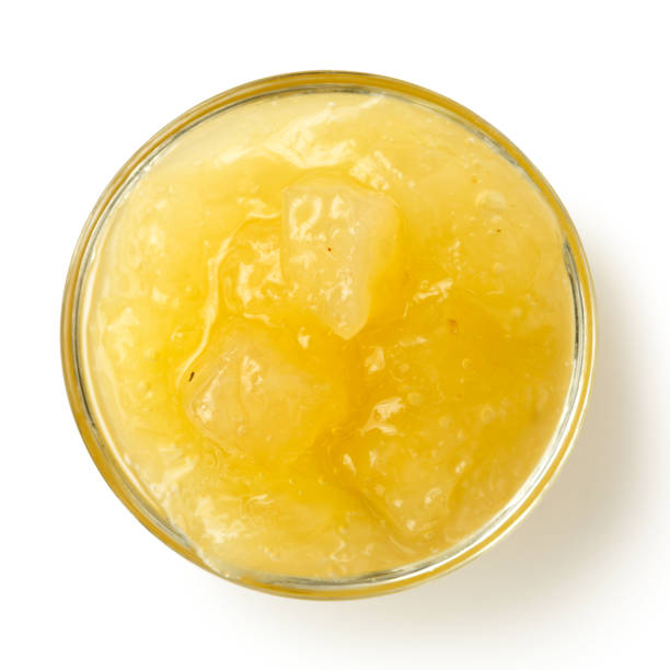 istock Bramley apple sauce in glass bowl isolated on white from above. 657174924