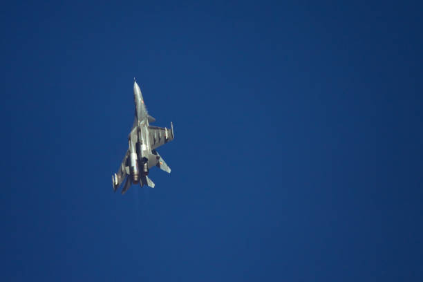 Military fighters jet three group aircraft at high speed, flying high in the sky